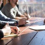 Utah business owners meeting with a CPA to plan a tax-efficient business restructuring