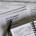 Small business owner reviewing IRS publications and tax resources at a desk