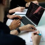 Utah entrepreneur meeting with CPA to analyze LLC vs S-Corp business structure options