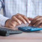 Business owner reviewing payroll tax compliance documents