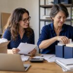 Bookkeeper helping a business owner organize overdue financial records
