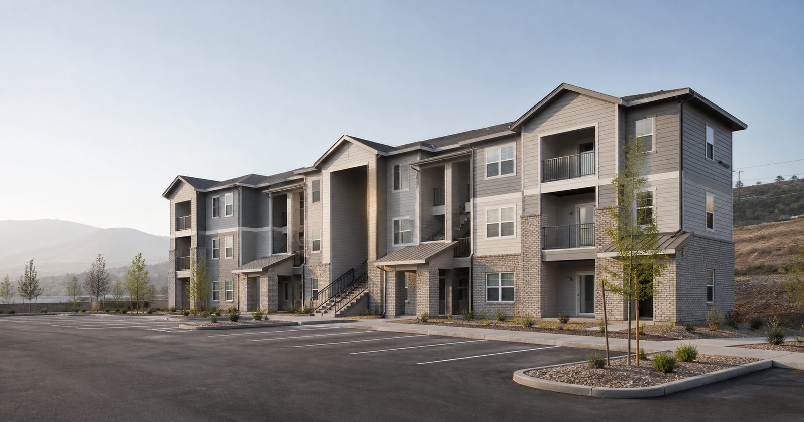 Newly built three-story affordable housing apartment community of the kind financed with tax-exempt bonds under the 4% LIHTC program
